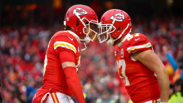 Patrick Mahomes and tight end Travis Kelce celebrate a touchdown against the Houston Texans during the second quarter in a AFC Divisional Round playoff football game at Arrowhead Stadium.